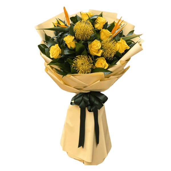 A bouquet of 10 yellow roses with bird of paradise and protea flowers wrapped with greenery